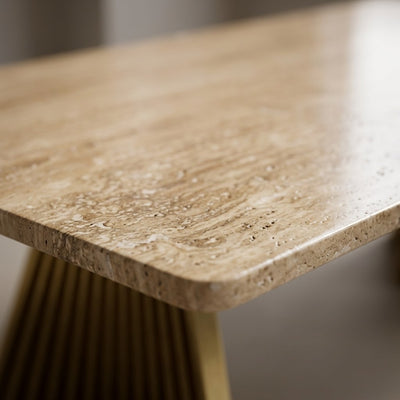 Honed Travertine Table with Sculptural Brass Base — marble detail